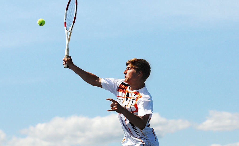 &lt;p&gt;Flathead's Kody Butts leaps in the air to return a ball at the net against C.M. Russell's Jeremy Ormseth at the AA Northern Divisional tennis tournament at Flathead Valley Community College on Thursday. (Aaric Bryan/Daily Inter Lake)&lt;/p&gt;