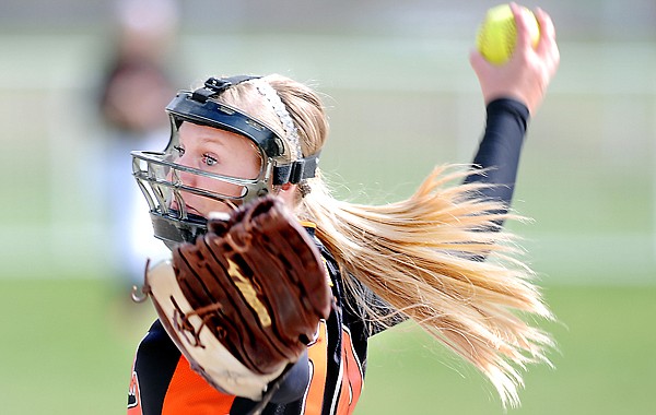 Flathead sophomore Sidney Alberts, 10, winds up for a pitch in the game against Missoula Hellgate on Friday afternoon in Kalispell.