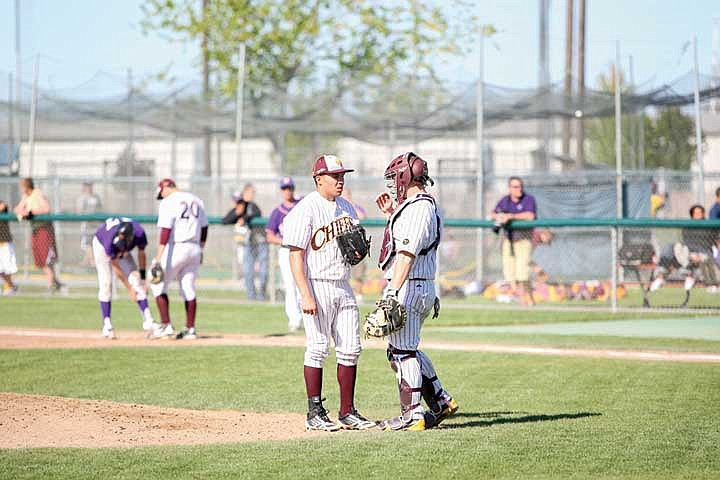 Hector Zavala and Elliot Sage talk strategy in the top of the third inning in Game 1 of the doubleheader.