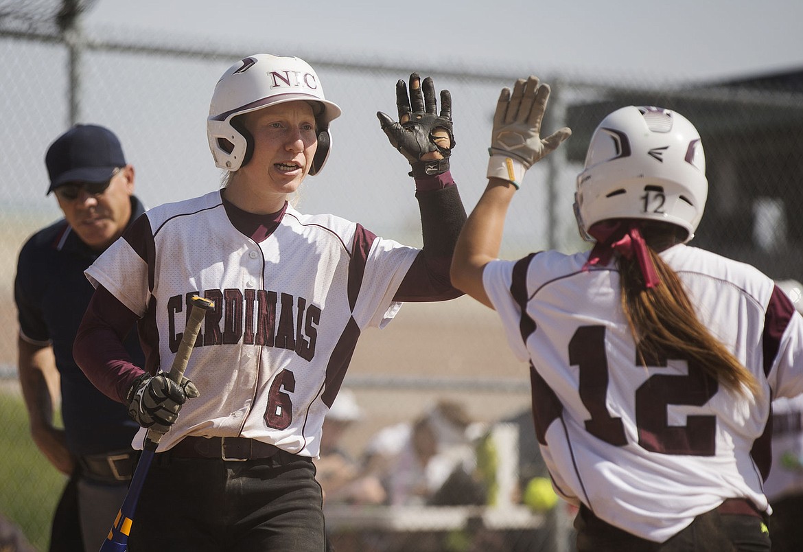 &lt;p&gt;LOREN BENOIT/Press Emily Aspden (12) receives a high five from teammate Lexi Courtney (6) as she heads back to the dugout after scoring against Yakima Valley Community College on Friday.&lt;/p&gt;