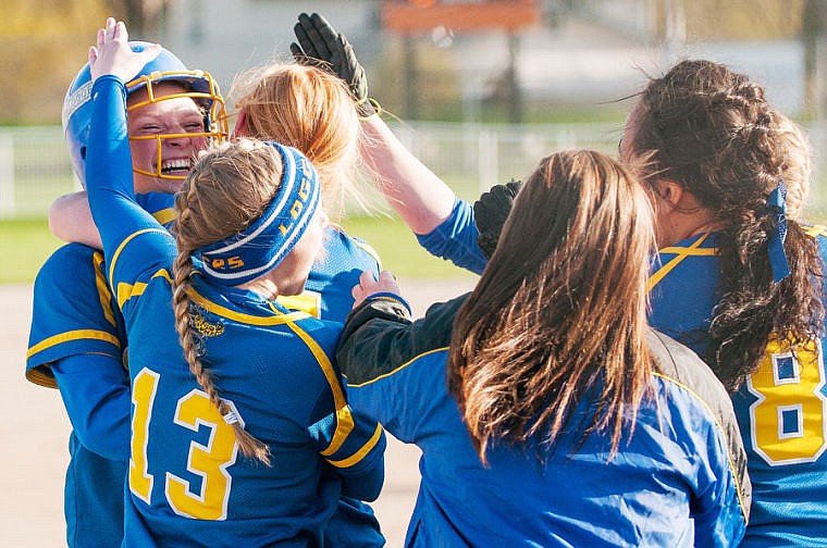 &lt;p&gt;Libby teammates meet senior Kelsey Klin (left) at home plate to celebrate her home run Tuesday afternoon during Flathead's matchup against Libby at Conrad Complex in Kalispell. May 6, 2014 in Kalispell, Montana. (Patrick Cote/Daily Inter Lake)&lt;/p&gt;