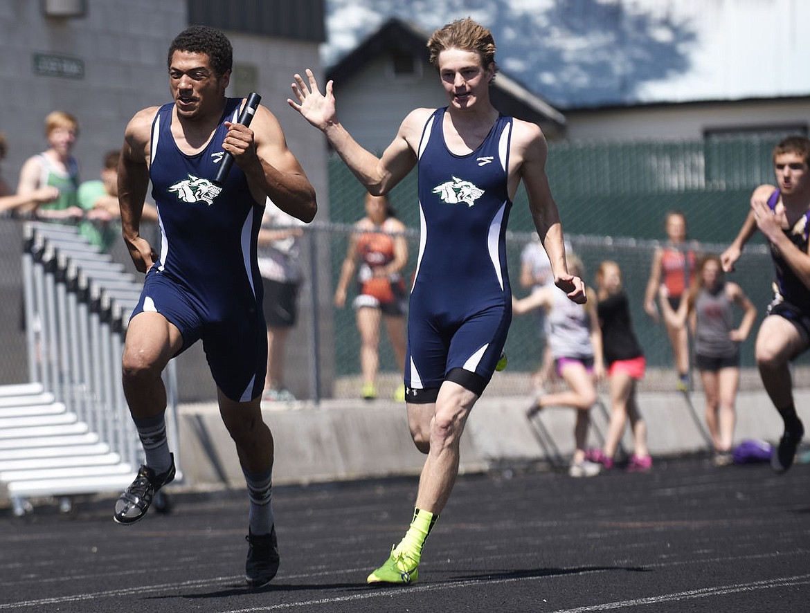 &lt;p&gt;Glacier senior Aaron Robinson takes off after getting the baton from Scout Willcut during the 400-meter relay at the Archie Roe Invitational at Legends Stadium on Saturday. The Wolfpack set a meet record. (Aaric Bryan/Daily Inter Lake)&lt;/p&gt;