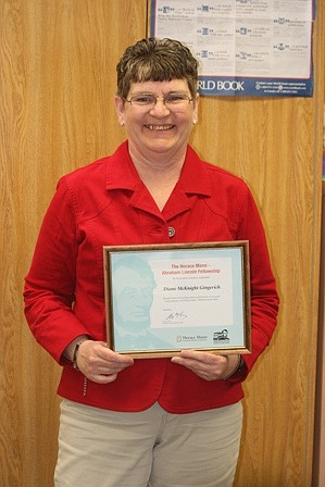 Diane Gingerich proudy displays her award. This summer, she will get to travel to Missouri to study Lincoln's life.
