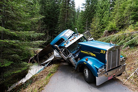 &lt;p&gt;An estimated 25 tons of sand spilled over the embankment near a flowing creek after the tractor trailer slid off the road.&lt;/p&gt;