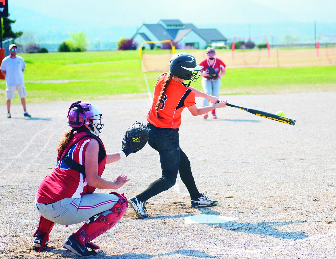 &lt;p&gt;Trotters junior Diana Woodward drives a pitch into the outfield during Plains-Hot Springs game against Loyola Sacred Heart last Tuesday.&lt;/p&gt;