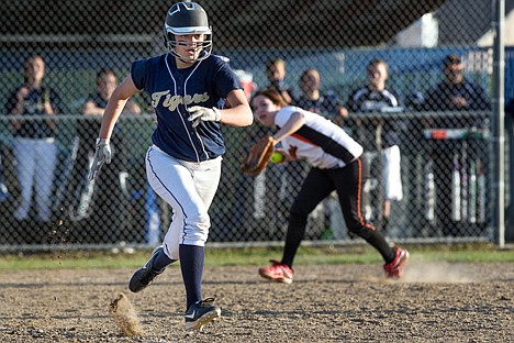 &lt;p&gt;Justina Kalar sprints to first after bunting the ball Wednesday during Timberlake&#146;s 3A District 1 tournament game against Priest River.&lt;/p&gt;