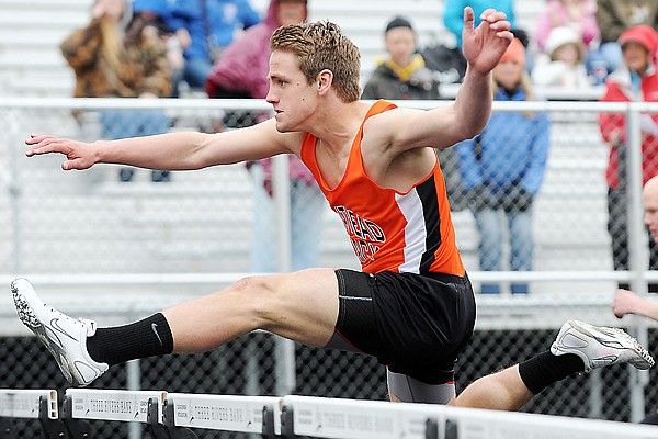 John Collins of Flathead competes in the hurdles on Saturday at the Archie Roe Track and Field Invitational in Kalispell.