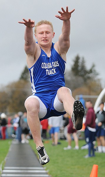 Nate Thompson of Columbia Falls competes in the long jump on Saturday at the Archie Roe Track and Field Invitational in Kalispell.