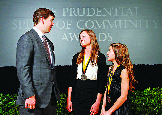 &lt;p&gt;Courtesy photo New York Giants quarterback and 2012 Super Bowl MVP Eli Manning congratulates Ariane Drake, 18, of Pocatello, center, and Emily Kladar, 12, of Hayden Lake, right, on being named Idaho's top two youth volunteers for 2012 by The Prudential Spirit of Community Awards.&lt;/p&gt;