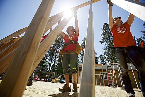 &lt;p&gt;Trudy Elliott, left, and Vicki Isakson help raise an exterior wall of a Habitat for Humanity home Tuesday in Coeur d'Alene. The volunteers in the Women Build program will be on site helping in construction efforts through the week.&lt;/p&gt;