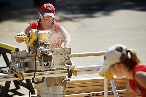 &lt;p&gt;Christi Fleischman cuts 2x4 lumber to size for the construction of the exterior walls of a Habitat for Humanity home Tuesday in Coeur d'Alene.&lt;/p&gt;