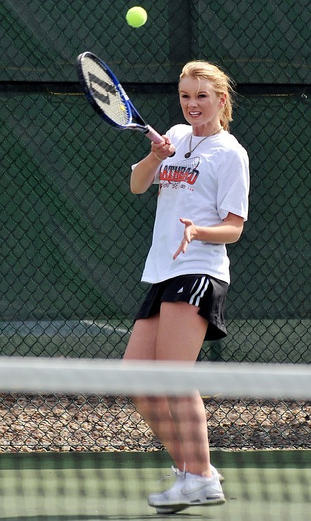 Flathead's Isabelle Brooks returns a shot from Glacier's Montana Ziglar during No. 4 singles play. Brooks won 6-4, 6-3.