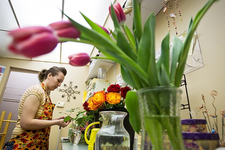 &lt;p&gt;Florist Amanda Caetano arranges orders for Mother's Day during her shift Friday at Sunflower Cottage and Villa Decor and Flowers in Coeur d'Alene.&lt;/p&gt;