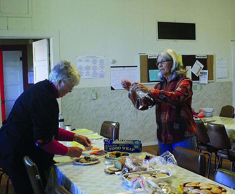 &lt;p&gt;Debbie Heckman wraps some baked goods for the May Day baskets.&#160;&lt;/p&gt;