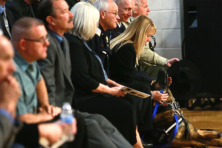 &lt;p&gt;Laurie Lowery comforts police K9 during the funeral of Sgt. Greg Moore on Saturday.&lt;/p&gt;