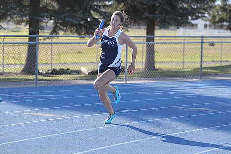 &lt;p&gt;Lake City High senior Maddi Ward takes the baton for the final leg of the 4x200-meter relay during the 5A Region 1 track and field meet on Thursday at Coeur d&#146;Alene High.&lt;/p&gt;