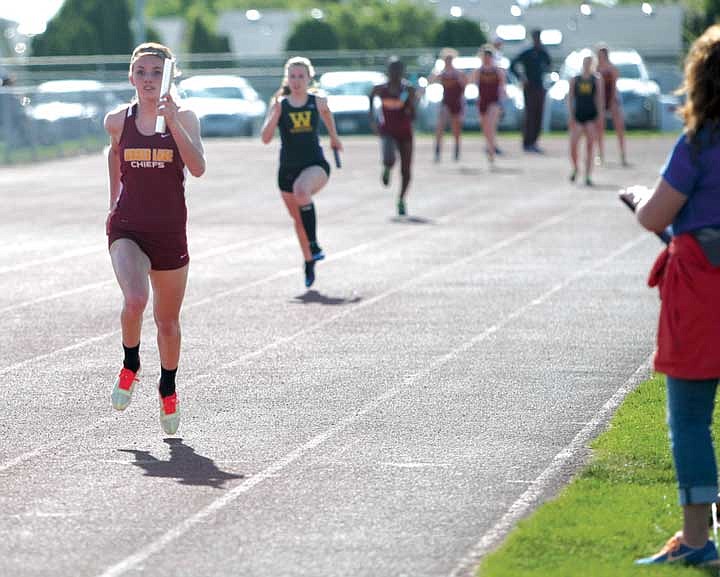 Caylah Lunning leads the pack during the 4x100 relay race. Moses Lake's 'A' team finished first.