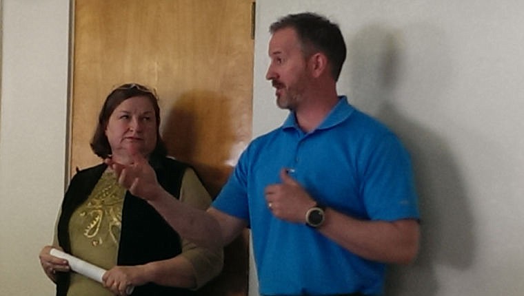 <p>Superior's Ev Schultz stands with contractor Dan McGee of McKinstry. Both hope to land $3.99 million for renovations. </p>