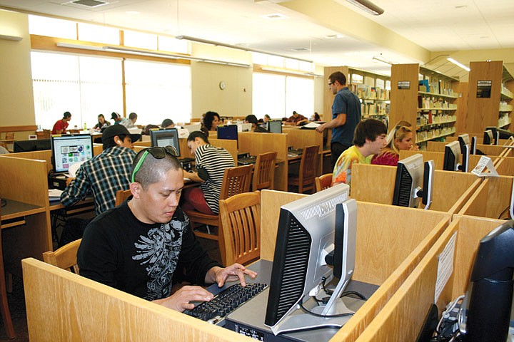 Big Bend Community College students take advantage of computers in the school library. Tuition could increase up to 12 percent under a proposal being considered by the Washington State Board of Community and Technical Colleges
