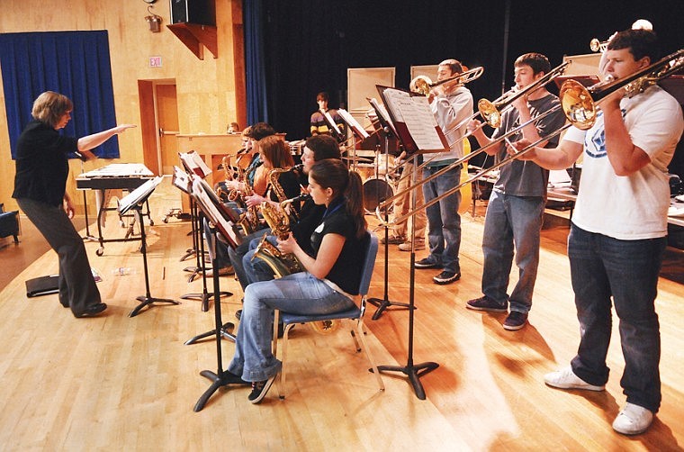 Karen Ulmer directs the Columbians in practice on Tuesday at Columbia Falls High School.