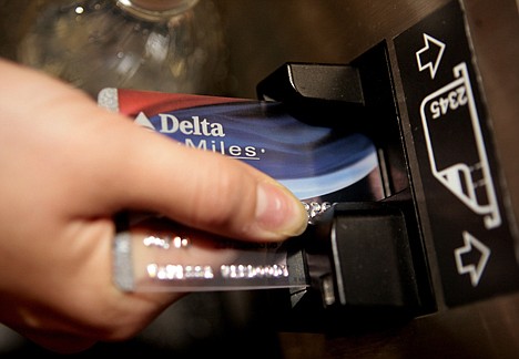 &lt;p&gt;In this Dec. 14, 2007 file photo, a traveler uses a Delta SkyMiles credit card to buy an airline e-ticket at the Bob Hope Airport in Burbank, Calif. Rewards cards _ typically reserved for those with good to excellent credit _ made up 88 percent of offers in the third quarter of 2009, up from 65 percent last year and 58 percent in 2007. (AP Photo/Damian Dovarganes, File)&lt;/p&gt;