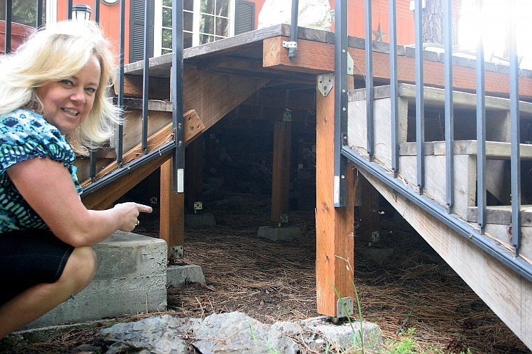 &lt;p&gt;Debbie Griggs indicates where the ewe bedded down beneath her porch for about a week.&lt;/p&gt;