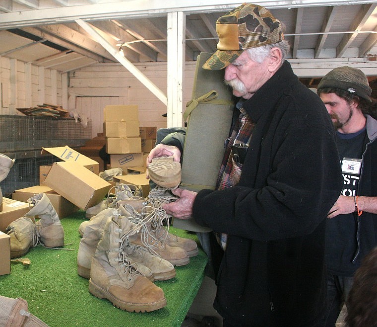 &lt;p&gt;U.S. Navy veteran Jerry Messing of Thompson Falls examines boots at the Tri-State Veterans Stand Down at the Sanders County Fairgrounds on May 6.&lt;/p&gt;