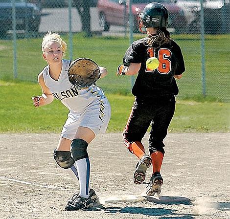 Flathead&#146;s Heather Haegele makes it safely to first base while Polson&#146;s first baseman Lindsey Rafter waits for the throw in the fifth inning of Flathead&#146;s first game against Polson on Tuesday in Kalispell. Flathead won the first game, 14-4, in five innings. Polson won the second game. Karen Nichols photos/Daily Inter Lake