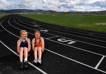 Track season standouts Lexy Boschee of Glacier, left, and Flathead's Tess Brenneman pose for a portrait at the Glacier High School track on Friday. Boschee shares the best high jump in the state having cleared 5-6. Brenneman has qualified for the Class AA state meet in four events and currently has the second fastest 400 time in the state. Allison Money/Daily Inter Lake