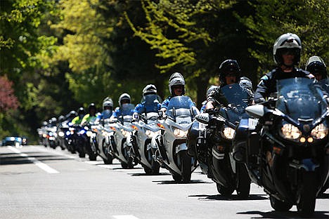 &lt;p&gt;The funeral procession for Sgt. Greg Moore takes a route on Government Way Saturday. Moore will be buried in the Forest Cemetery in Coeur d&#146;Alene.&lt;/p&gt;