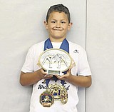 ML wrestler Andreck Johnson wins triple crown