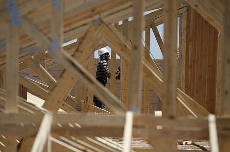 &lt;p&gt;A worker helps to frame a new home at a housing tract in Las Vegas on April 13.&lt;/p&gt;