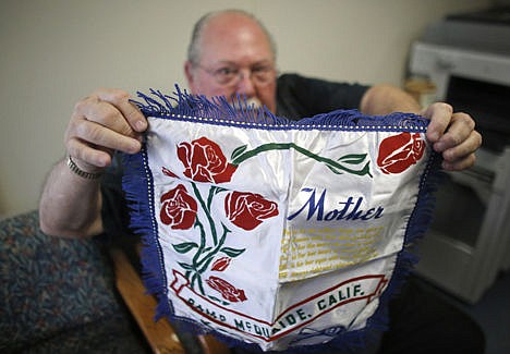 &lt;p&gt;Don Lamoureux displays a World War II era pillow sham at a senior center in Millville, Mass., on Tuesday.&#160;&lt;/p&gt;