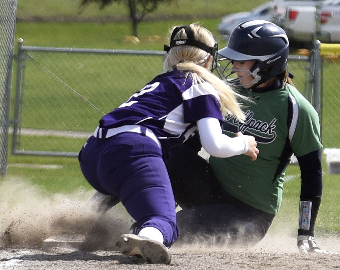 &lt;p&gt;Glacier junior Emma Shew slides under the tag of Butte third baseman Isabelle Bonney as she steals third base during the Wolfpack's 6-0 victory Tuesday, May 10, 2016 at Kidsports Complex. (Aaric Bryan/Daily Inter Lake)&lt;/p&gt;