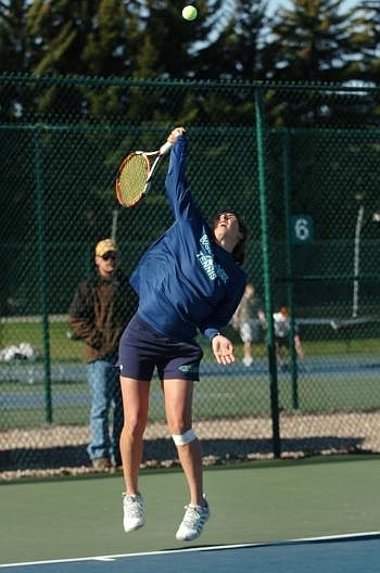 Glacier's Liana Bates serves at the Flathead Invitational at Flathead Valley Community College on Saturday morning. Nate Chute/Daily Inter Lake