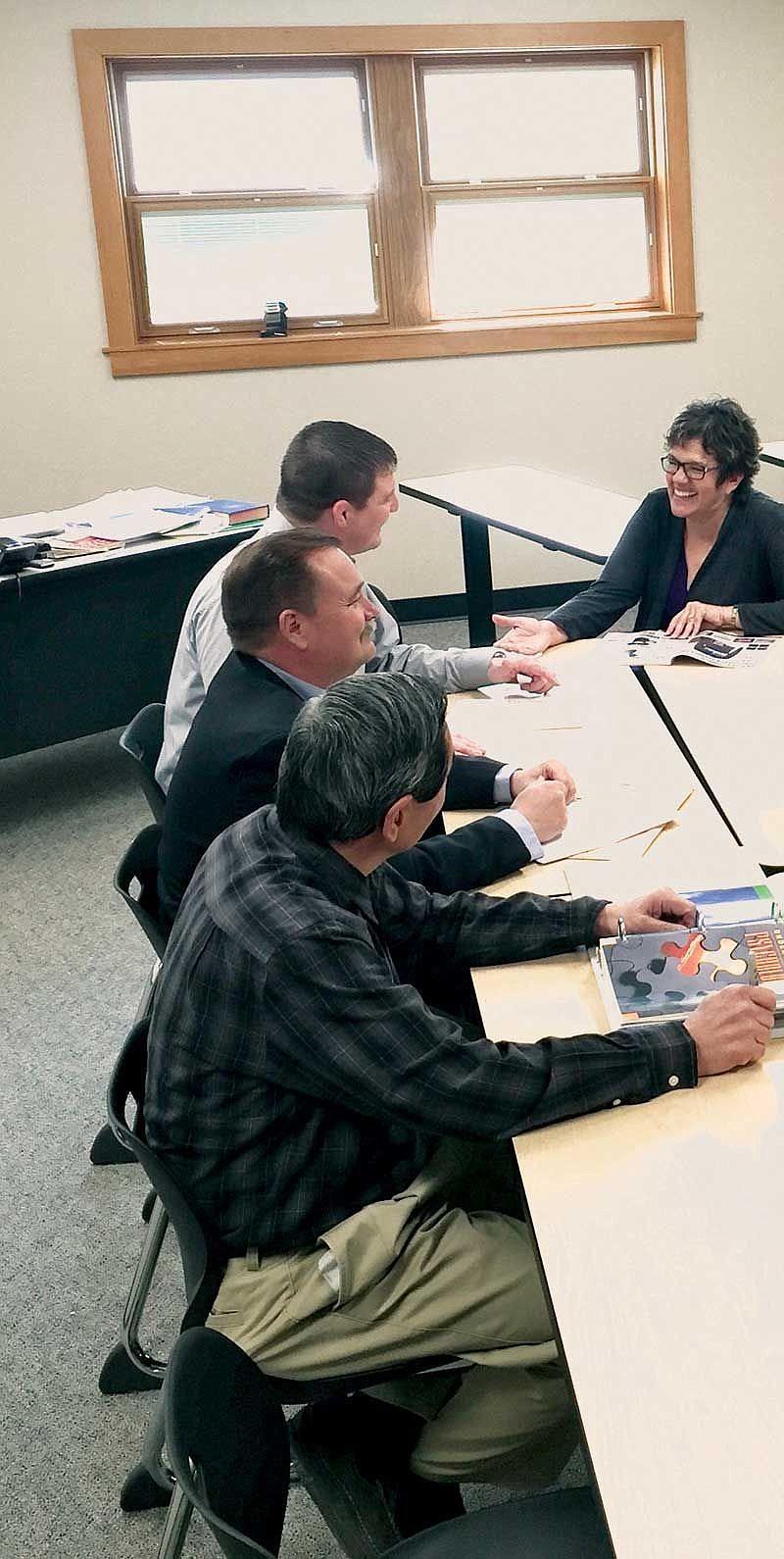 Superintendent Rose Search meets with building and program administrators at one of the school buildings.