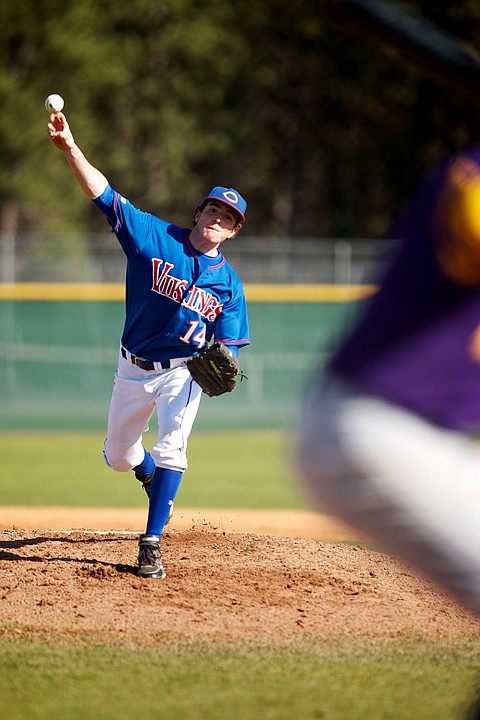 <p>Coeur d'Alene High's Jake Pereira releases the ball at the top of his pitch as he zeros in on the strike zone Tuesday during the 5A Region 1 tournament championship game against Lewiston High School.</p>