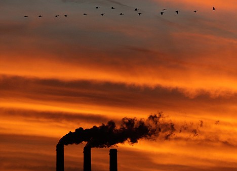 &lt;p&gt;A flock of Geese fly past the smokestacks at the Jeffrey Energy Center coal power plant as the suns sets on Dec. 2, 2012 near Emmett, Kan. Worldwide levels of the chief greenhouse gas that causes global warming have hit a milestone, reaching an amount never before encountered by humans, federal scientists said Friday.&lt;/p&gt;