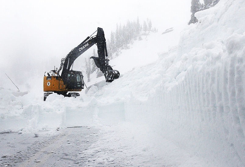 &lt;p&gt;&lt;strong&gt;An excavator&lt;/strong&gt; takes a bite out of snow on Glacier National Park's Going-to-the-Sun Road near Logan Pass on Monday. (Aaric Bryan/Daily Inter Lake)&lt;/p&gt;