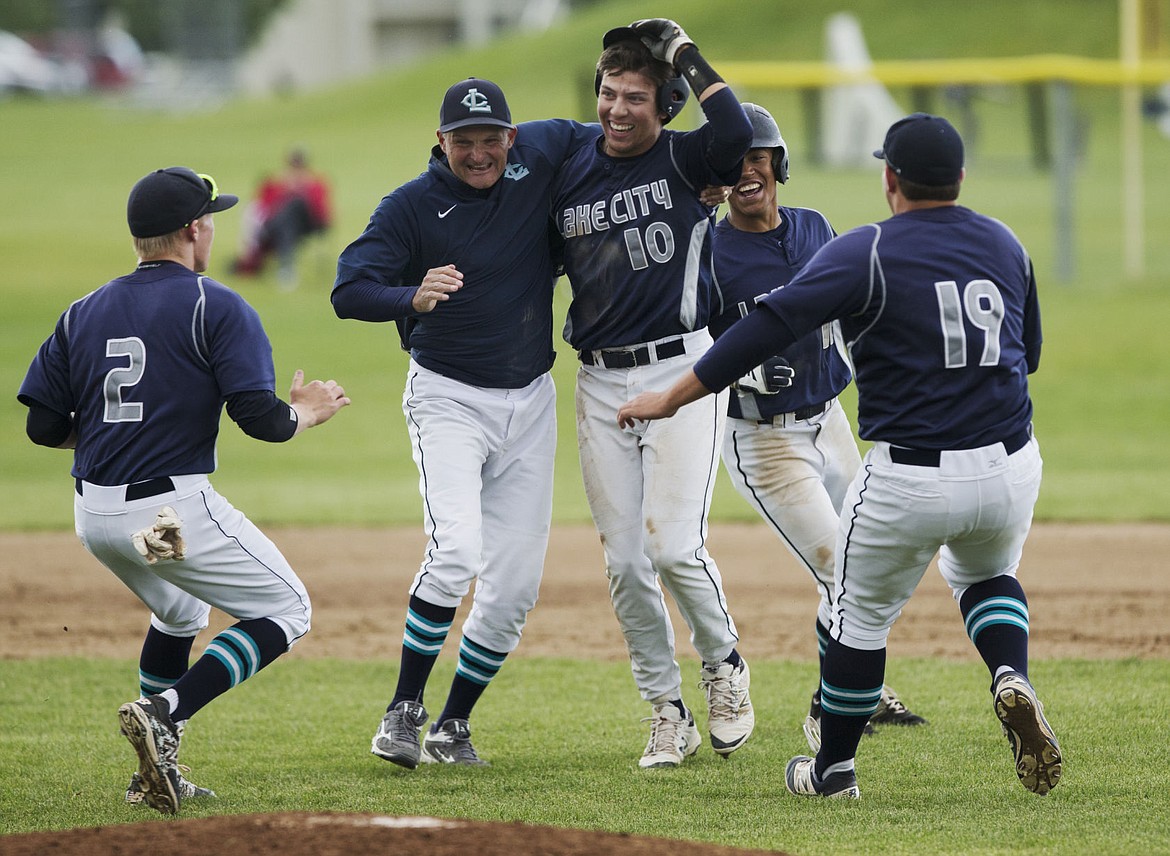 &lt;p&gt;LOREN BENOIT/Press Lake City's Brandon Stapleton (10) celebrates his walk-off RBI ground-rule double with coach Paul Manzardo, middle, Kodie Kolden (2) Dominic Conigliaro (19) and Kaleb Reid (12) during the 5A Region 1 Championship game against Post Falls on Tuesday.&lt;/p&gt;