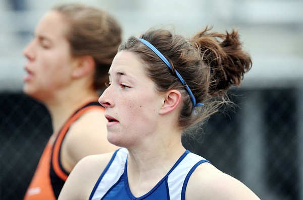 Glacier's Maddey Frey competes with Flathead's Tess Brenneman during the 100 trials at the Archie Roe Track Meet on Saturday in Kalispell.