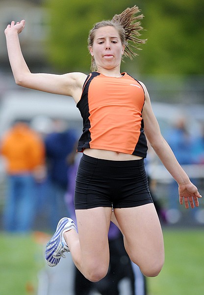 Flathead's Tess Brenneman competes in the long jump on Saturday at the Archie Roe Track Meet in Kalispell.