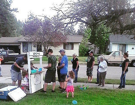 &lt;p&gt;Patrons of the &#147;Lemon Aid&#148; stand opened by Kamber Sue&#146;s 4-year-old son Zane line up to support the venture on Sunday in Coeur d&#146;Alene. His goal was to raise $20 to support the Moore family, but he reached $50.&lt;/p&gt;