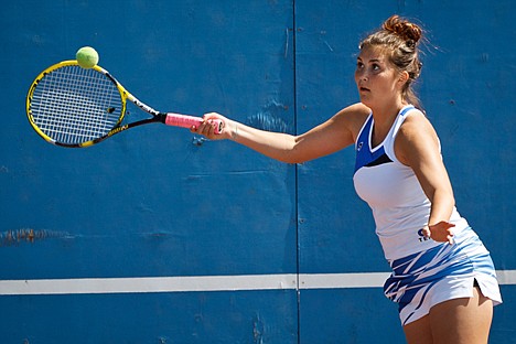 &lt;p&gt;Sloane Booterbaugh, a junior at Coeur d'Alene High School, returns the ball during the semi-final round of mixed doubles Friday at the 5A Region 1 tennis tournament at Coeur d'Alene High.&lt;/p&gt;