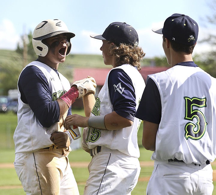 &lt;p&gt;Anthony Jones celebrates with teammates after scoring a run during the Mariners' game Sunday afternoon.&lt;/p&gt;