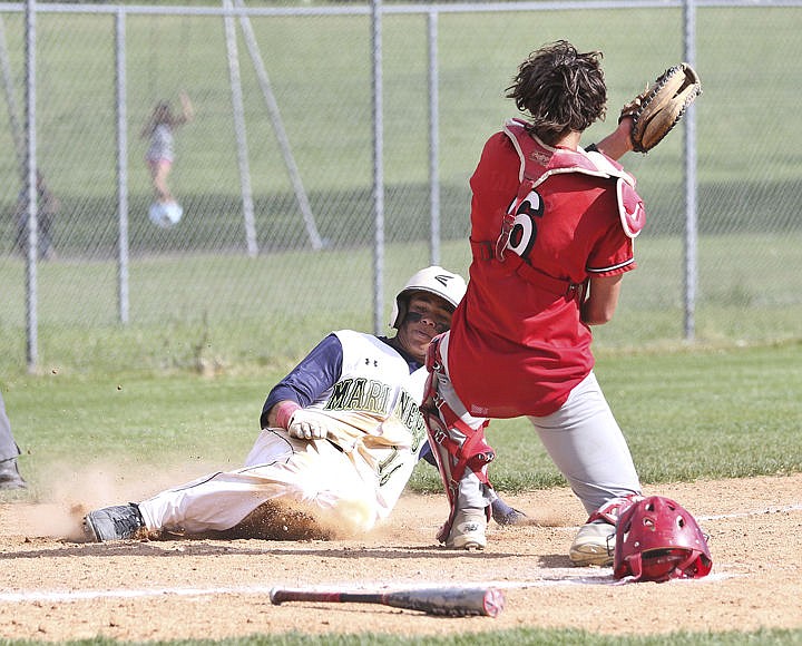 &lt;p&gt;Anthony Jones slides into home base safe during the Mariners' game Sunday against Kalispell.&lt;/p&gt;