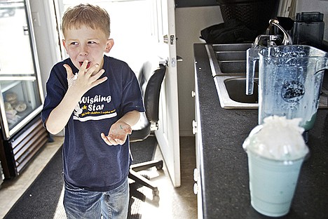 &lt;p&gt;Damien Day, 10, licks his fingers after he accidentally sprayed too much whip cream on his bubble gum-flavored smoothie Friday at The Grind Espresso in Coeur d'Alene. Damien's mother, Valerie Hays, owns the coffee stand and donated all profits from sales Friday to the Wishing Star Foundation which provided services for Damien and his family following the surgical removal and chemotherapy for a brain tumor that was discovered when Damien was 3.&lt;/p&gt;