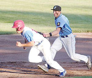 &lt;p&gt;Missoula Pioneers' Koahl DeShazer gets caught in a rundown by shortstop Dylon Lane second out top of one May 8.&lt;/p&gt;