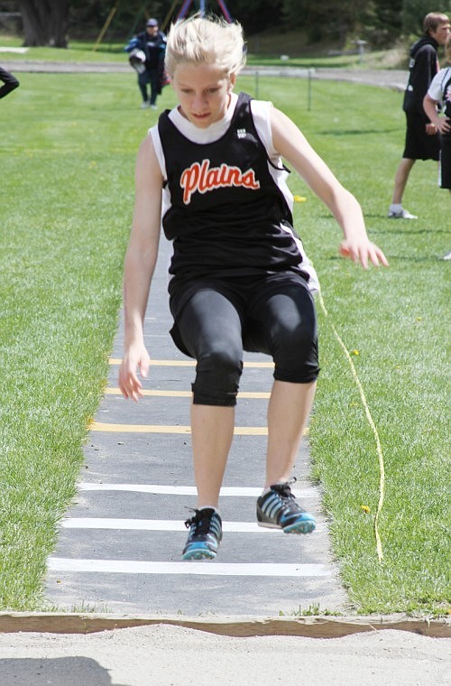 Andrea Wood competes in the long jump.