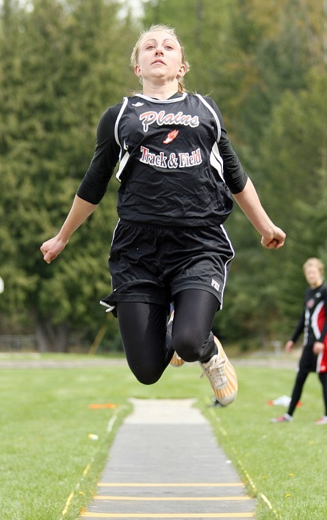Kelsey Beagley soars in the long jump.